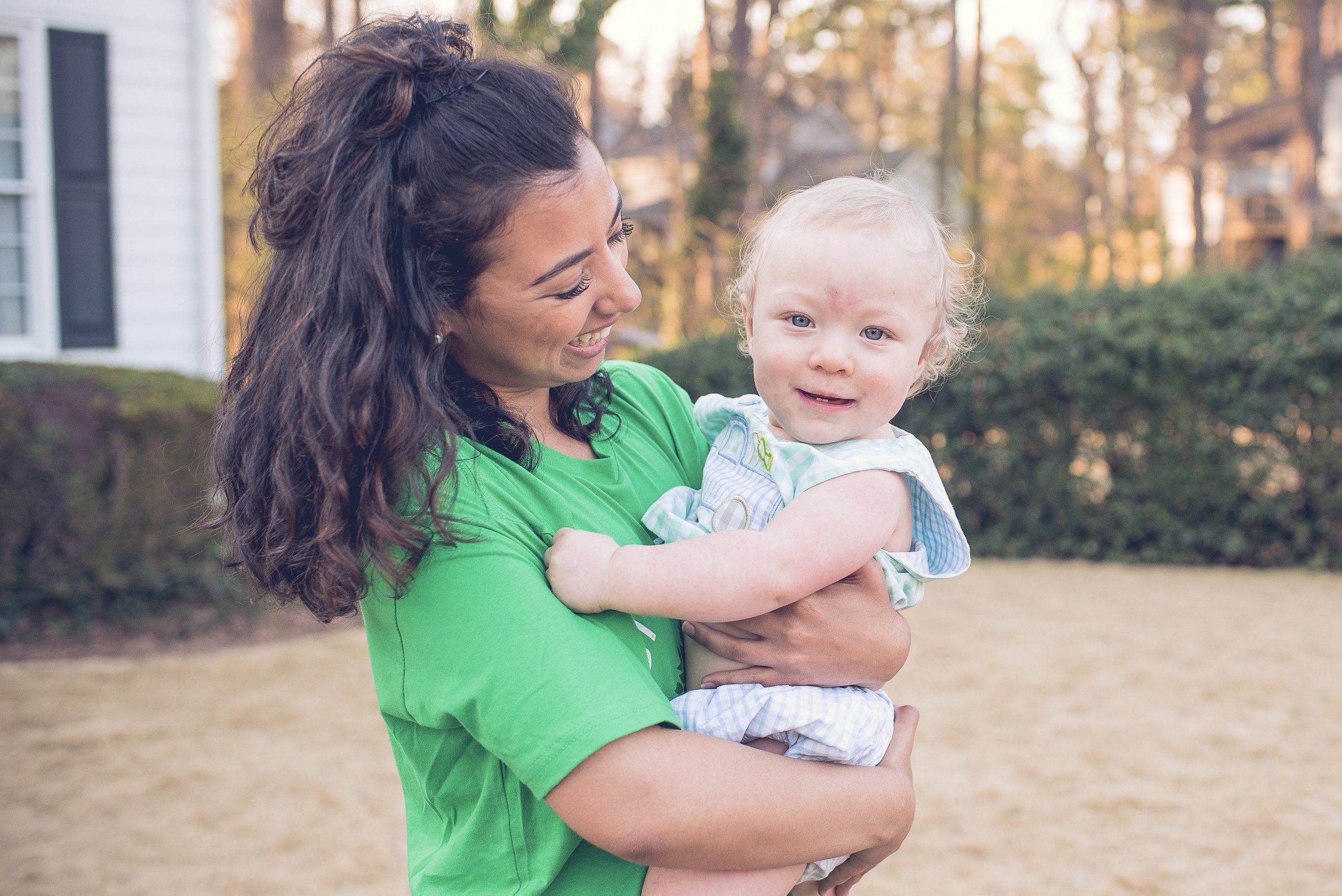 a college student works a babysitting job babysitter with child